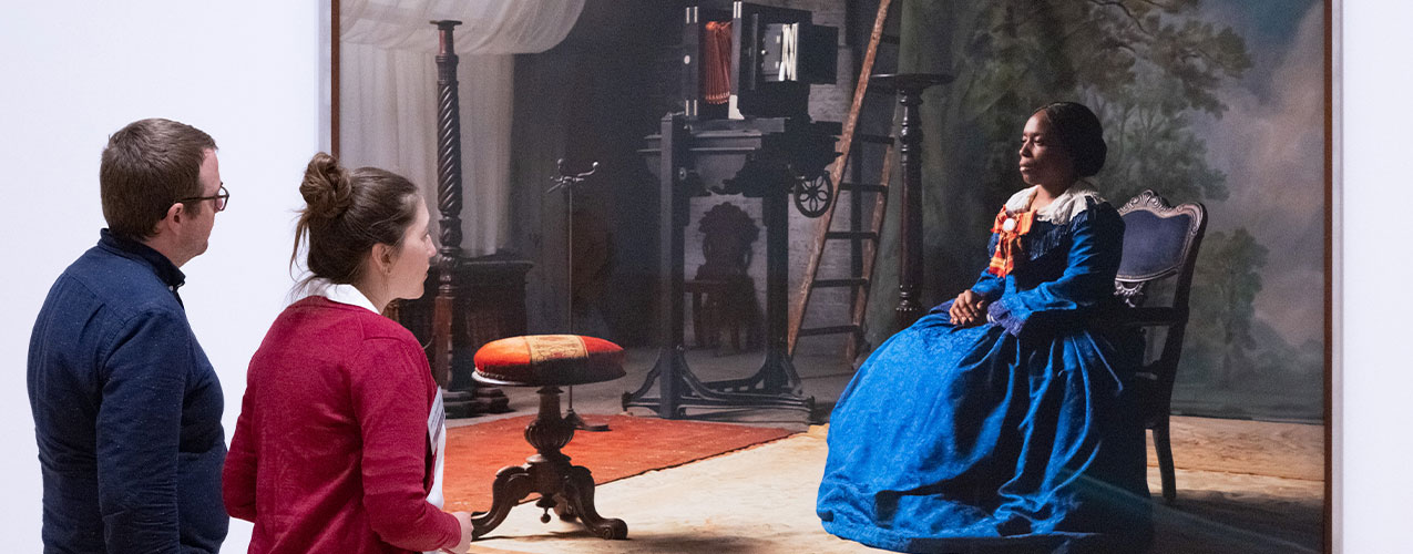 UC alumni enjoy the exhibition of Sir Isaac Julien at the Tate Britain. Image Credit: Fiona Hanson.